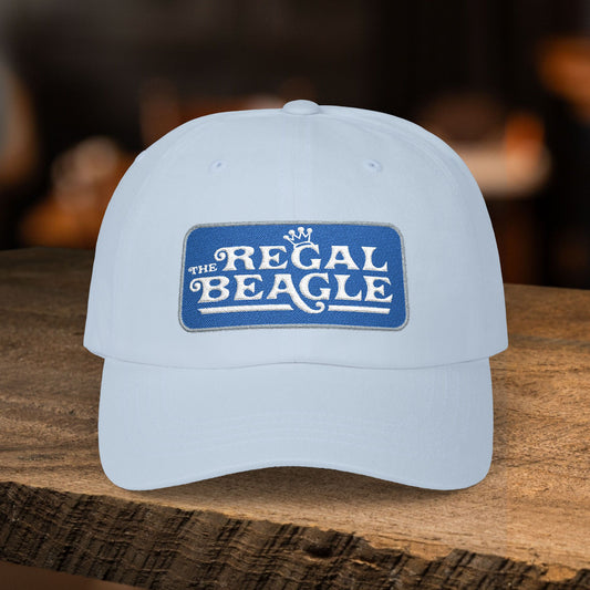 Light blue dad cap with embroidered Regal Beagle patch logo, Three's Company inspired fictional bar merch