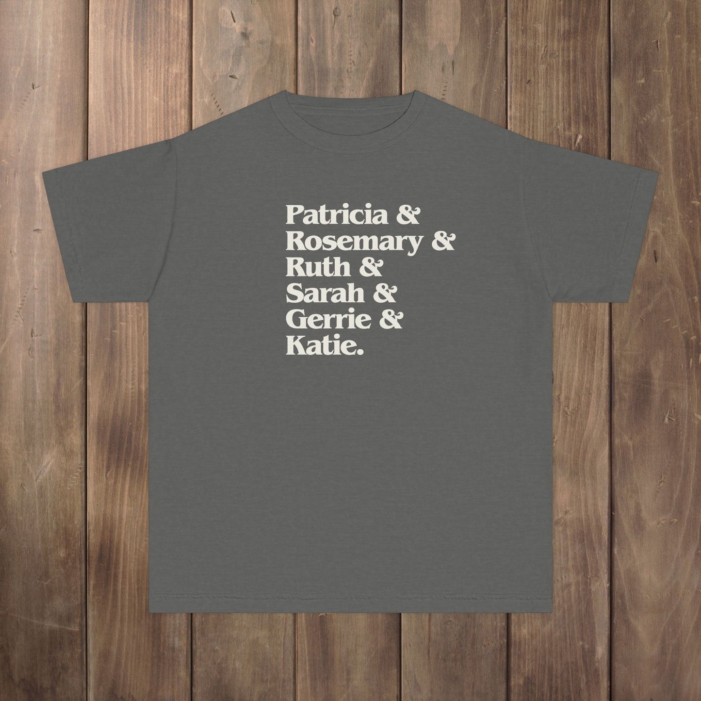 Pepper gray youth kids tee with stacked Women of Widow's Bay names in cream type