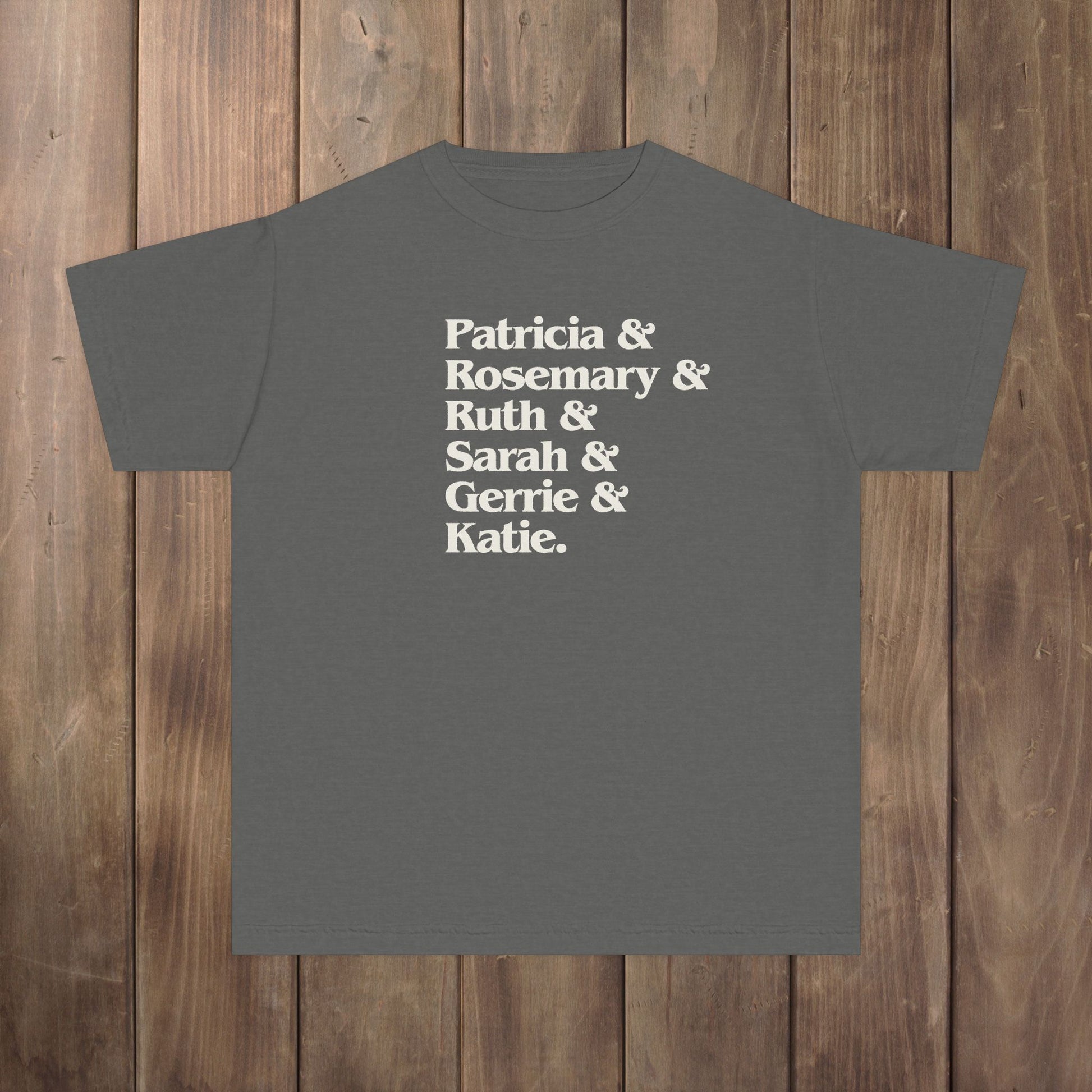 Pepper gray youth kids tee with stacked Women of Widow's Bay names in cream type