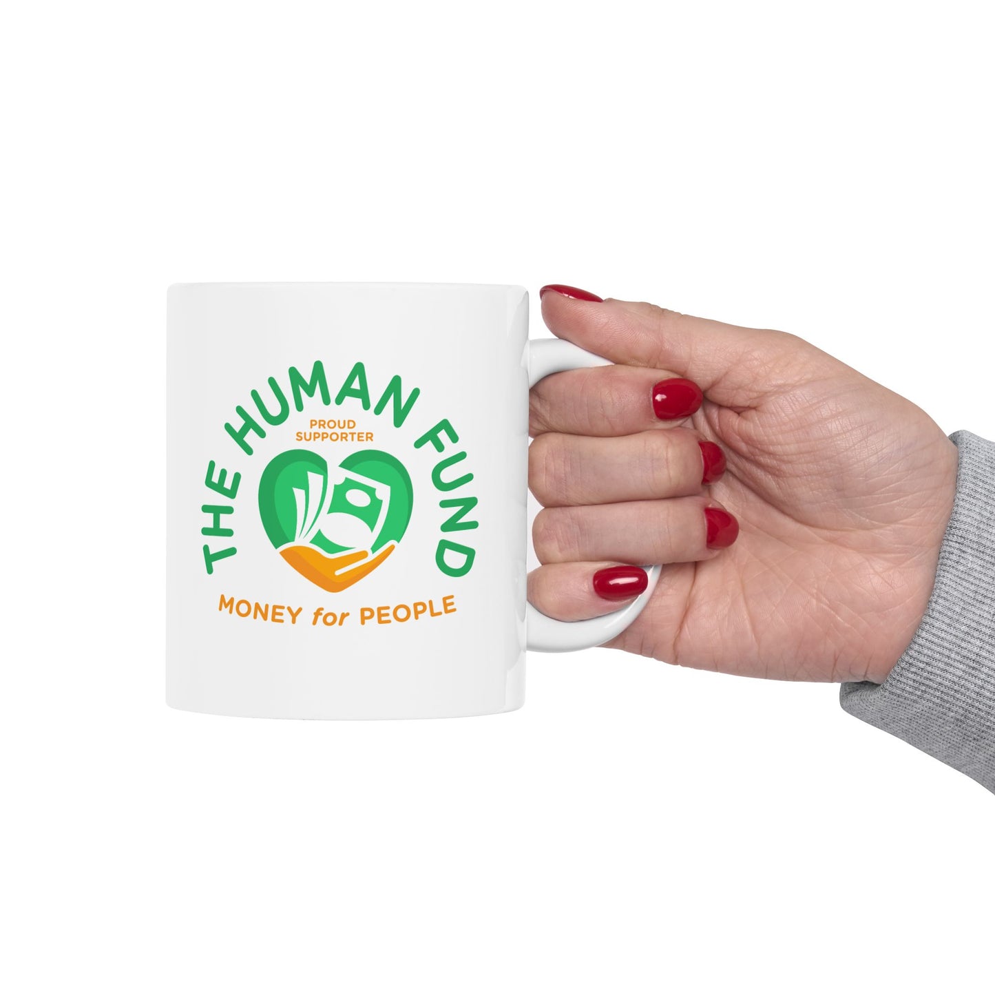 White mug with 'The Human Fund' logo held by a hand on a white background
