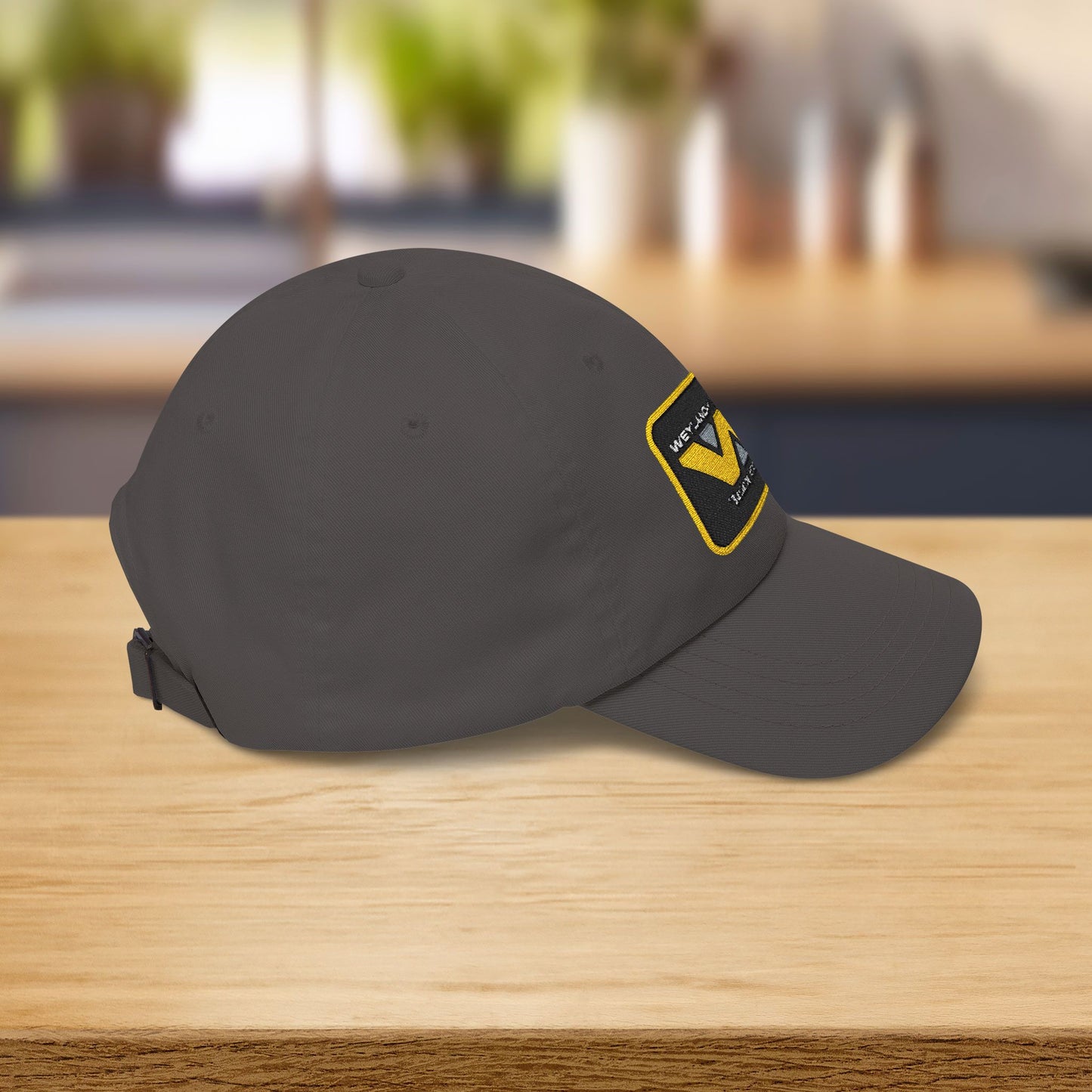 Right Side view of Yupoong dad cap with embroidered Weyland-Yutani Corp patch logo from the Alien franchise in yellow and silver