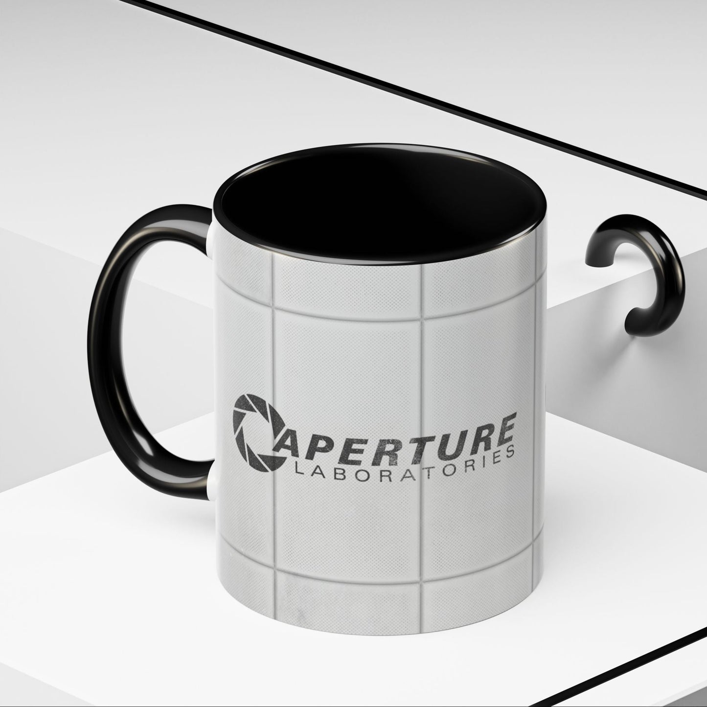 Angled view of Black accent 11oz mug with Aperture Laboratories logo, Portal test chamber panel wall wrap, logo printed both sides.