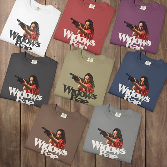 Eight folded Comfort Colors tee swith a vector illustration of Patricia from Widow's Bay and the pun text "Widow's Bae"