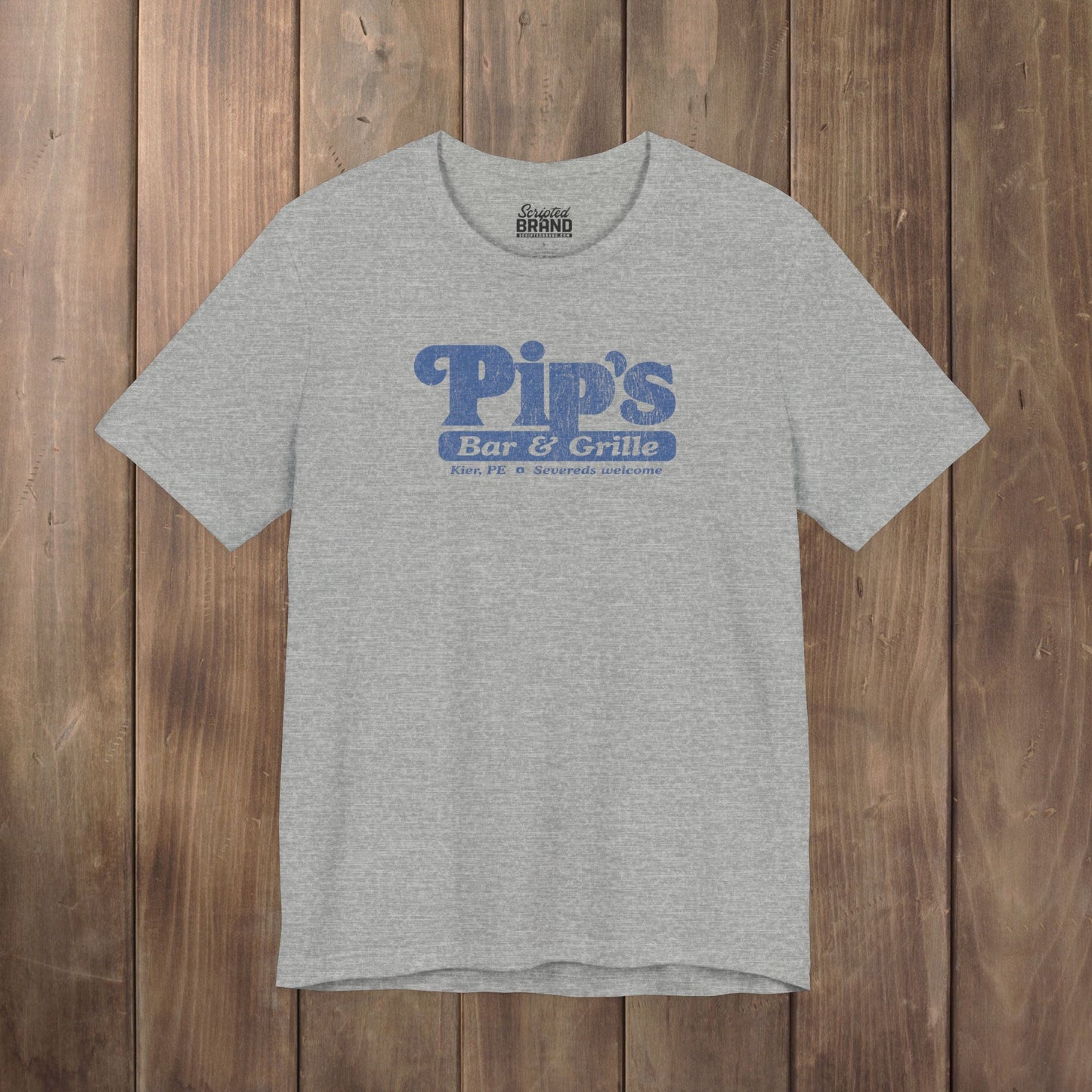 Heather gray Bella+Canvas t-shirt with the Pips Bar and Grill logo from the TV show Severance in a vintage distressed style.