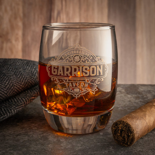 Lifestyle photo of 6 ounce Whiskey Glass featuring the Garrison Tavern Logo inspired by the TV show Peaky Blinders printed on one side.