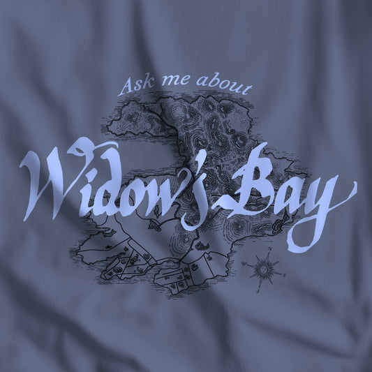 Closeup of Patricia Midnight blue Comfort Colors tee with a vintage island map and antique "Ask Me About Widow's Bay" type from the Apple TV show