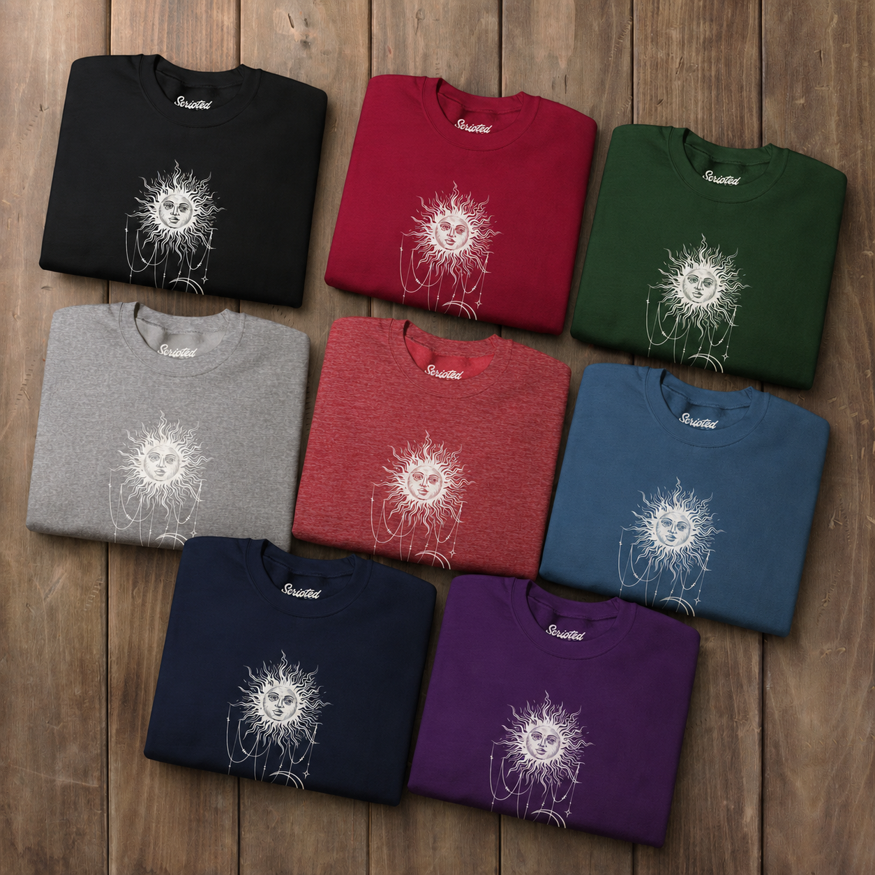 Eight folded crewneck sweatshirts with boho celestial sun face, stars, and crescent moon design worn by Patricia in Widow's Bay