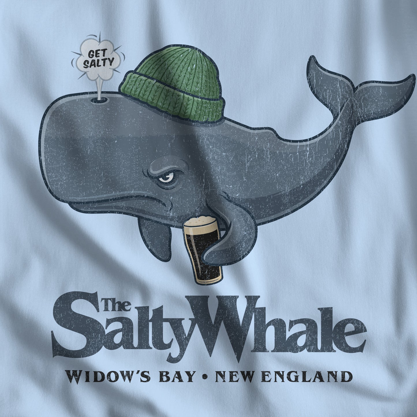 Closeup of 'The Salty Whale' cartoon mascot hoodie inspired by Widow's Bay Apple TV series, heavy blend pullover sweatshirt