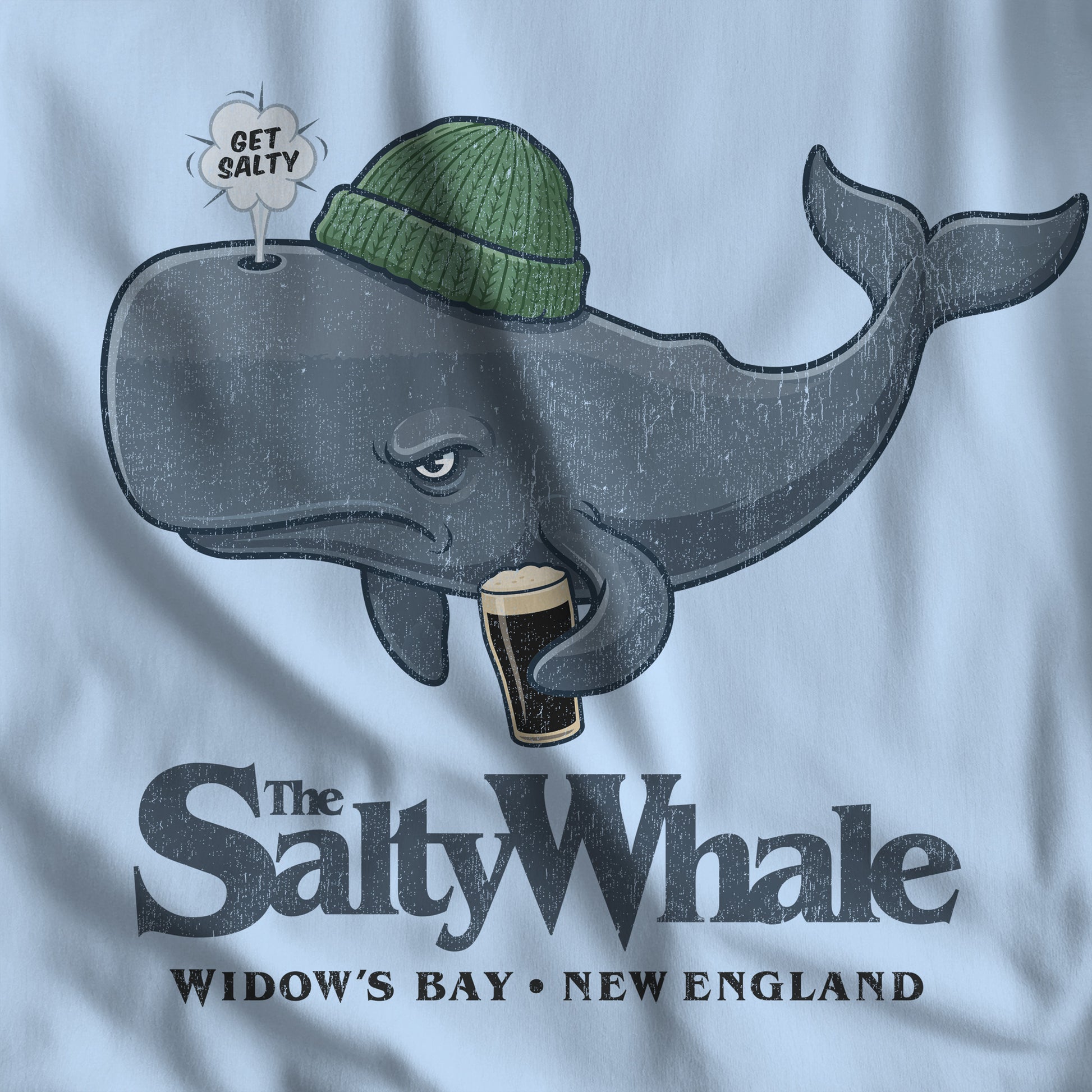 Closeup of 'The Salty Whale' cartoon mascot hoodie inspired by Widow's Bay Apple TV series, heavy blend pullover sweatshirt