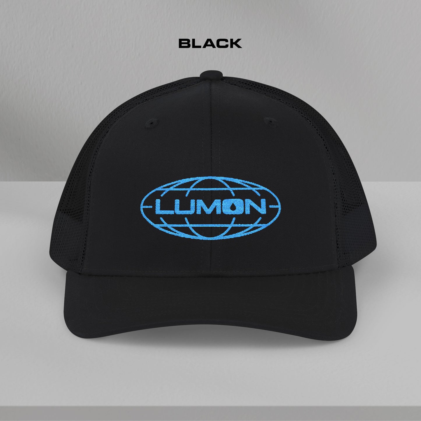 Front view of a black Richardson 112 trucker cap with embroidered blue Lumon Industries logo inspired by Severance.