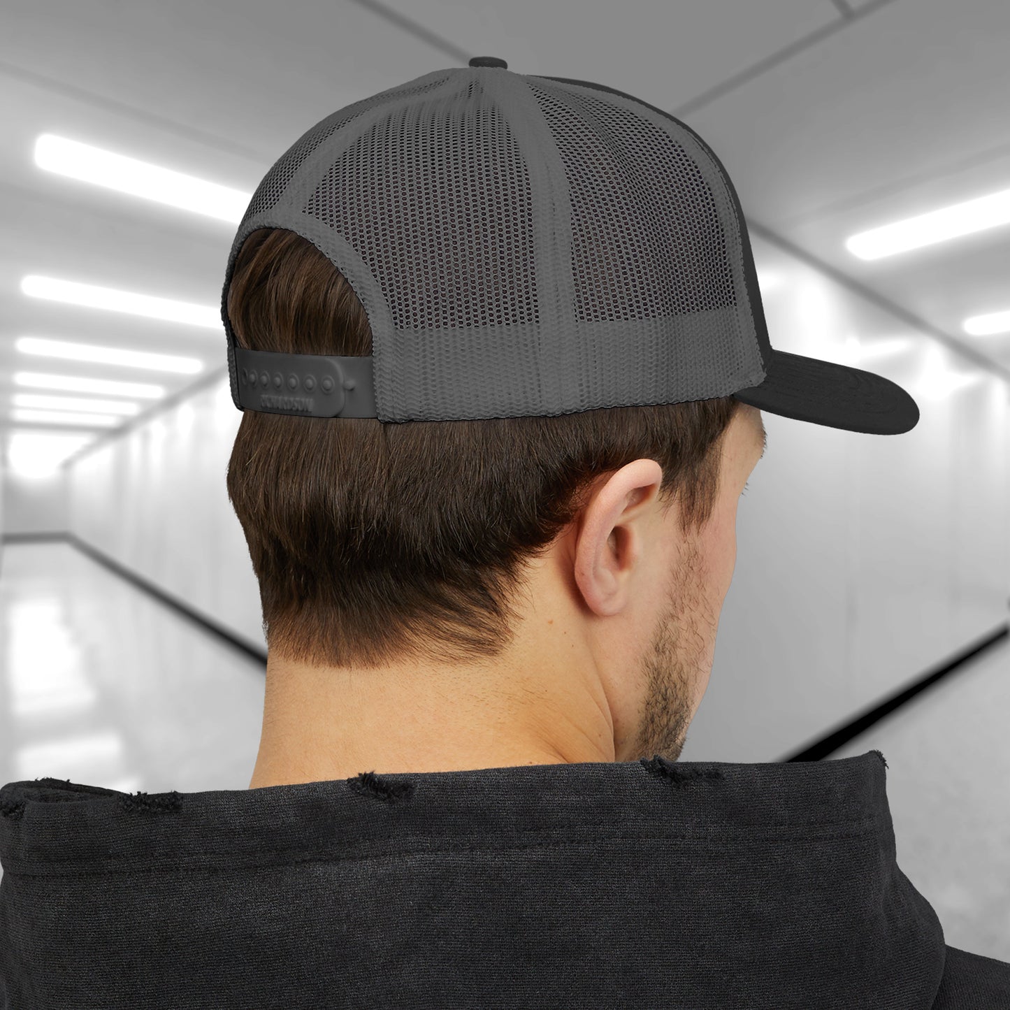 Back view of man wearing Richardson 112 trucker hat with embroidered Pip’s Bar & Grille logo inspired by Severance.