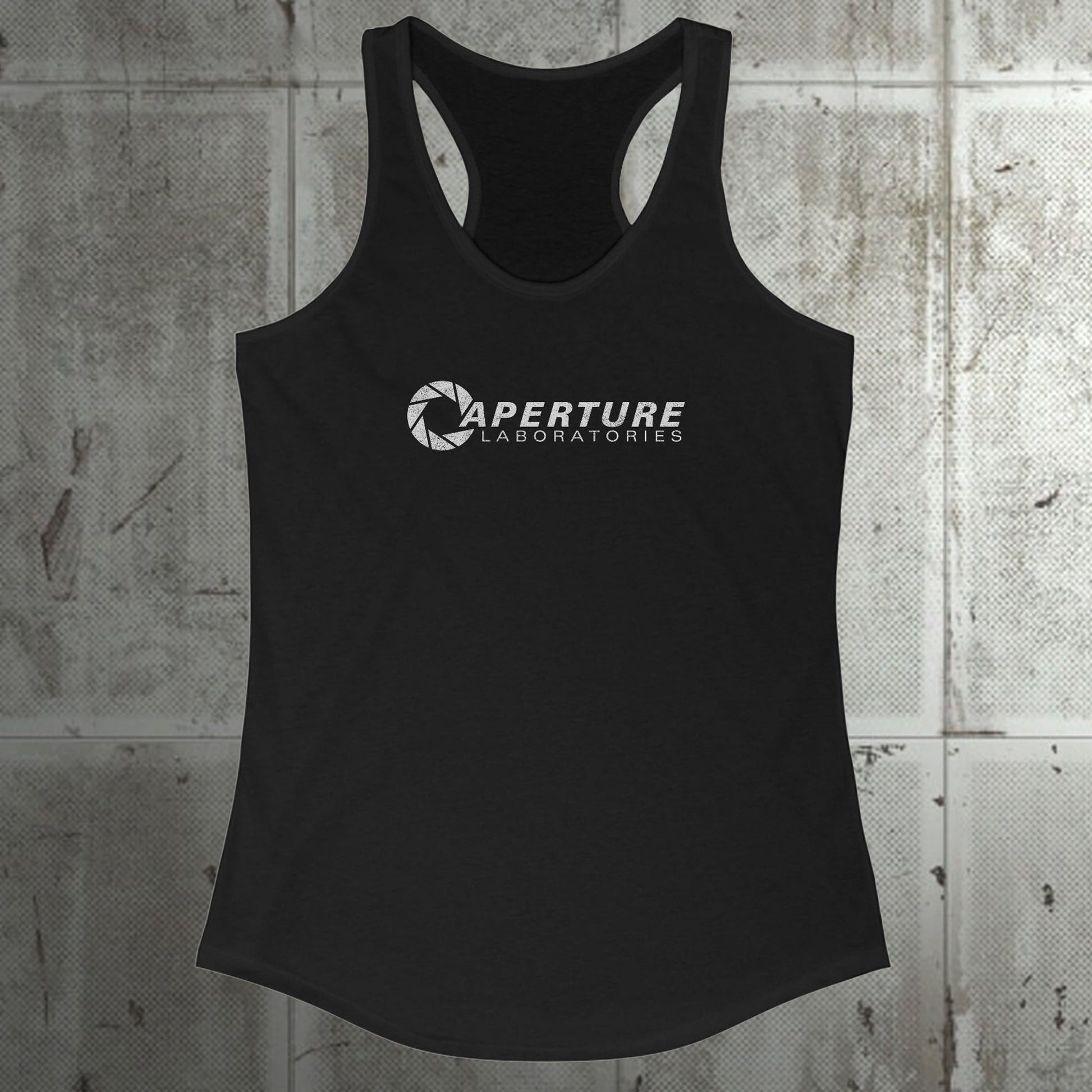 Front view of a black colored Women's Racerback Tank Top Shirt featuring the Aperture Laboratories logo from the video games Portal and Portal 2 in a vintage distressed style, sold by ScriptedBrand. 