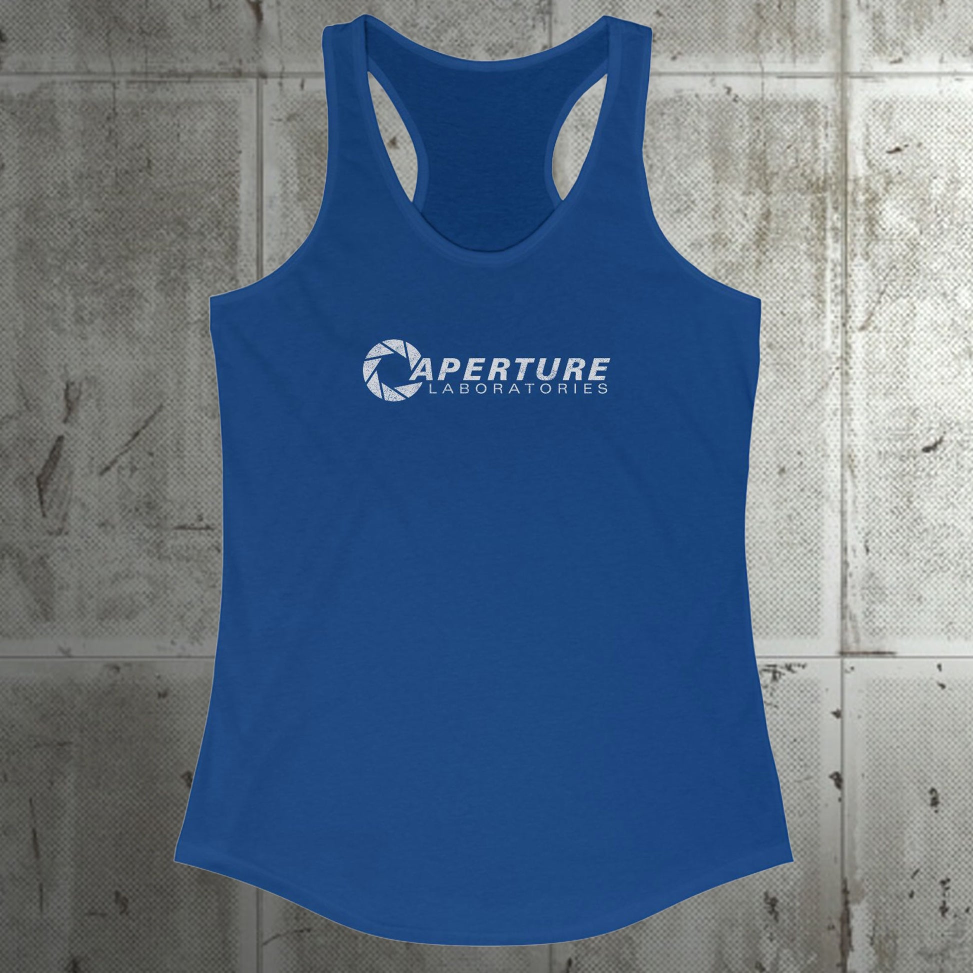 Front view of a royal blue colored Women's Racerback Tank Top Shirt featuring the Aperture Laboratories logo from the video games Portal and Portal 2 in a vintage distressed style, sold by ScriptedBrand. 