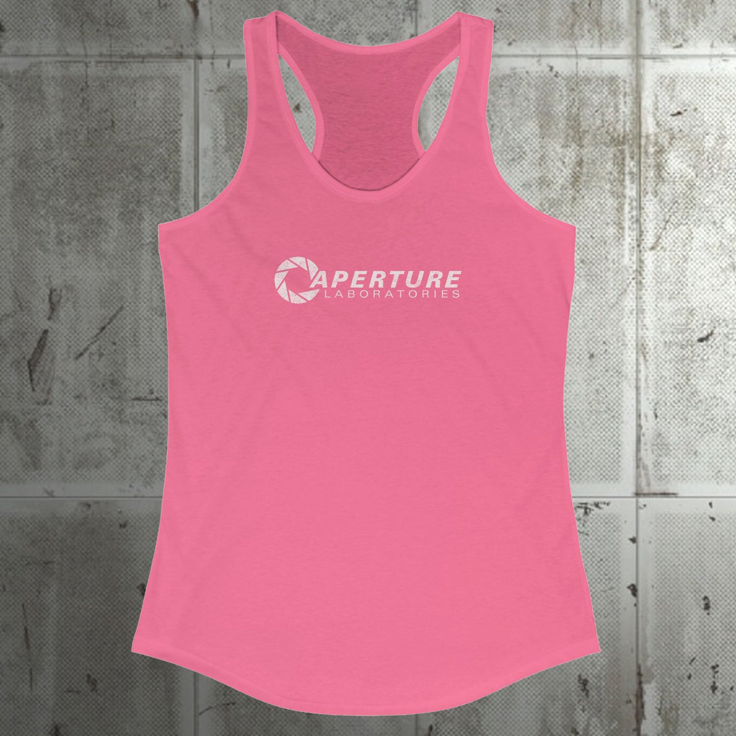 Front view of a hot pink colored Women's Racerback Tank Top Shirt featuring the Aperture Laboratories logo from the video games Portal and Portal 2 in a vintage distressed style, sold by ScriptedBrand. 