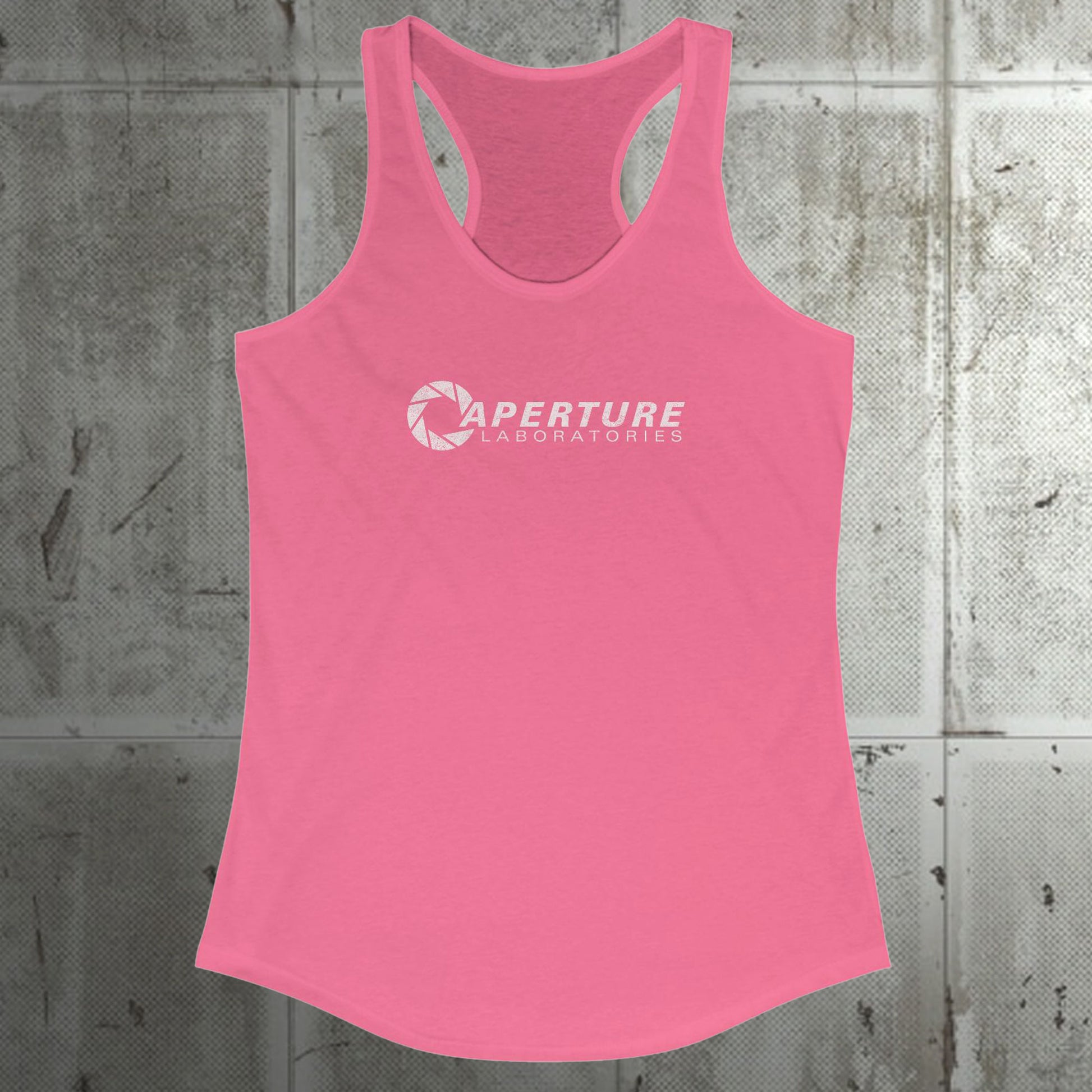 Front view of a hot pink colored Women's Racerback Tank Top Shirt featuring the Aperture Laboratories logo from the video games Portal and Portal 2 in a vintage distressed style, sold by ScriptedBrand. 