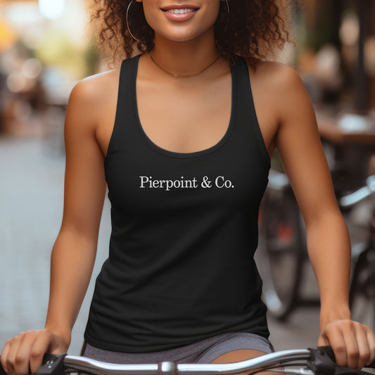 Female model wearing a black colored Women's Racerback Tank Top Shirt featuring the Pierpoint & Co logo from the HBO TV show Industry, sold by ScriptedBrand. 
