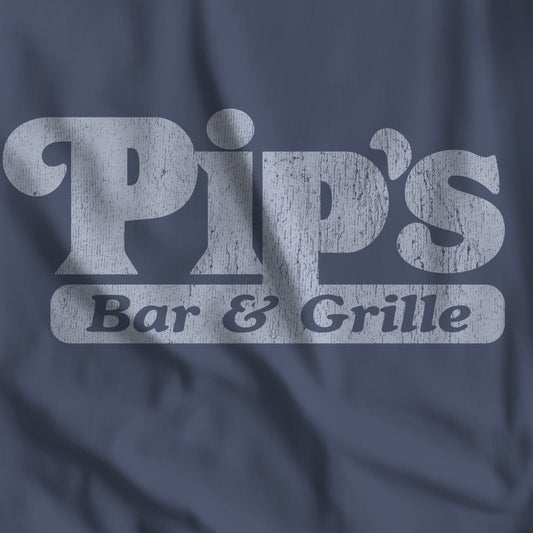 Closeup of midnight blue vintage-style Pip’s Bar and Grill t-shirt from TV show Severance on Comfort Colors 1717 tee.