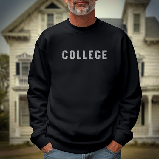 Male model wearing a black colored soft unisex Gildan 18000 sweatshirt with the word COLLEGE that John Belushi wore in the movie Animal House, in a vintage distressed ink-stamped worn-in style, sold by ScriptedBrand.