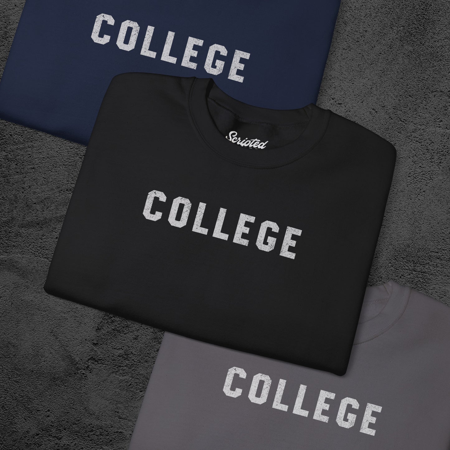Group of 3 folded soft unisex Gildan 18000 sweatshirts with the word COLLEGE that John Belushi wore in the movie Animal House, in a vintage distressed ink-stamped worn-in style, sold by ScriptedBrand.