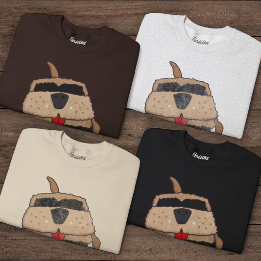 Four folded sand colored Gildan 18000 crewneck sweatshirts with Mutt Cutts dog van vintage distressed graphic, mockup front view