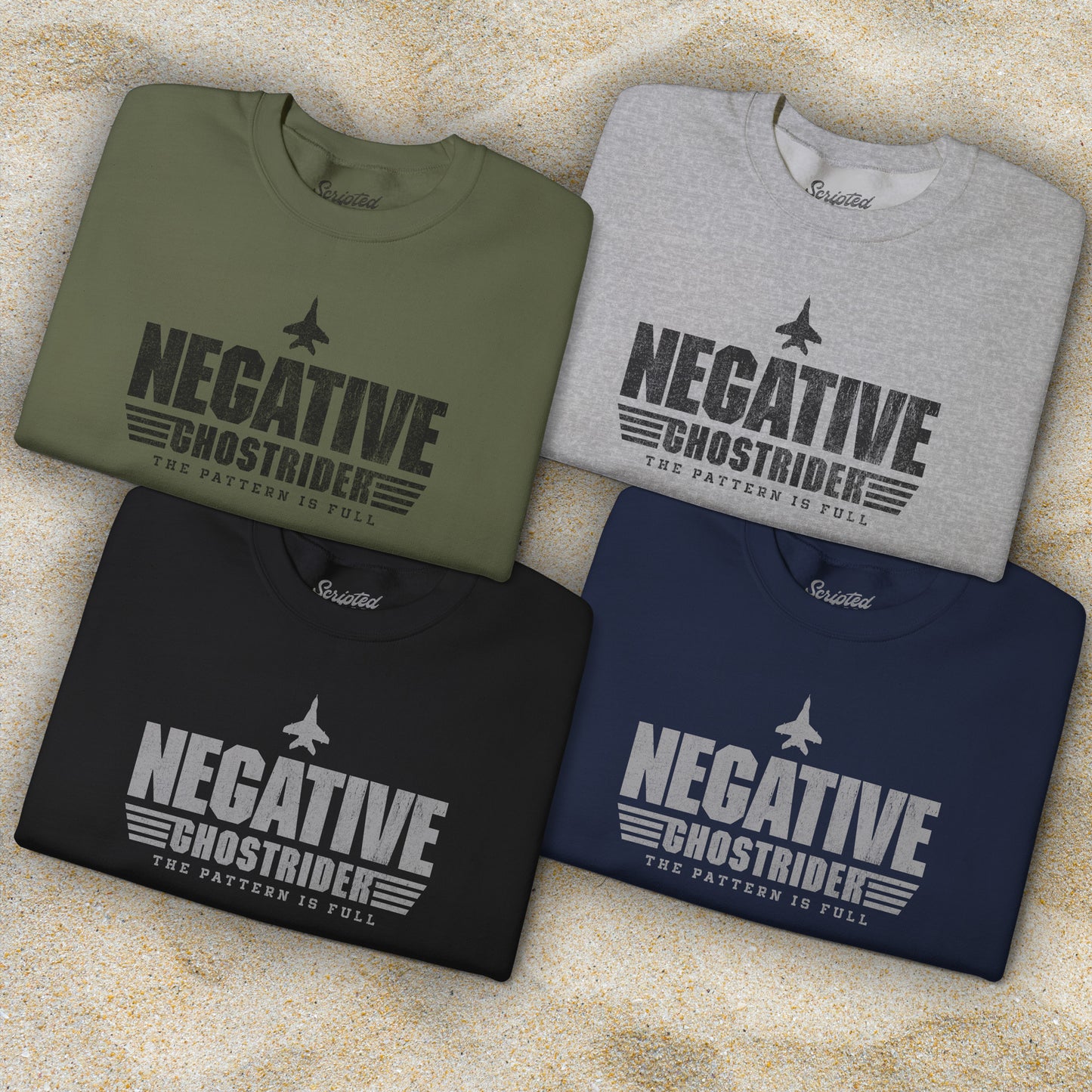 Four folded sweatshirts with distressed “Negative Ghostrider, The Pattern Is Full” design inspired by Top Gun.