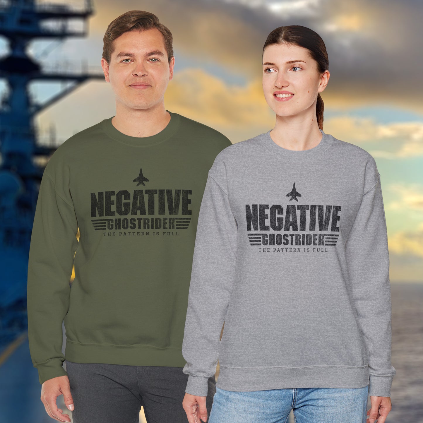 Two people wearing sweatshirts with 'Negative Ghostrider' text against a blurred background.