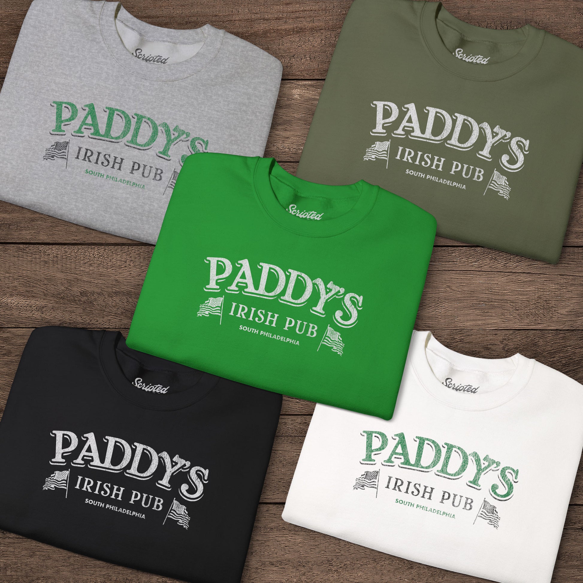 Five folded Crewneck Sweatshirts with the Paddy's Pub logo graphic from the TV Show Its Always Sunny in Philadelphia in a vintage style.