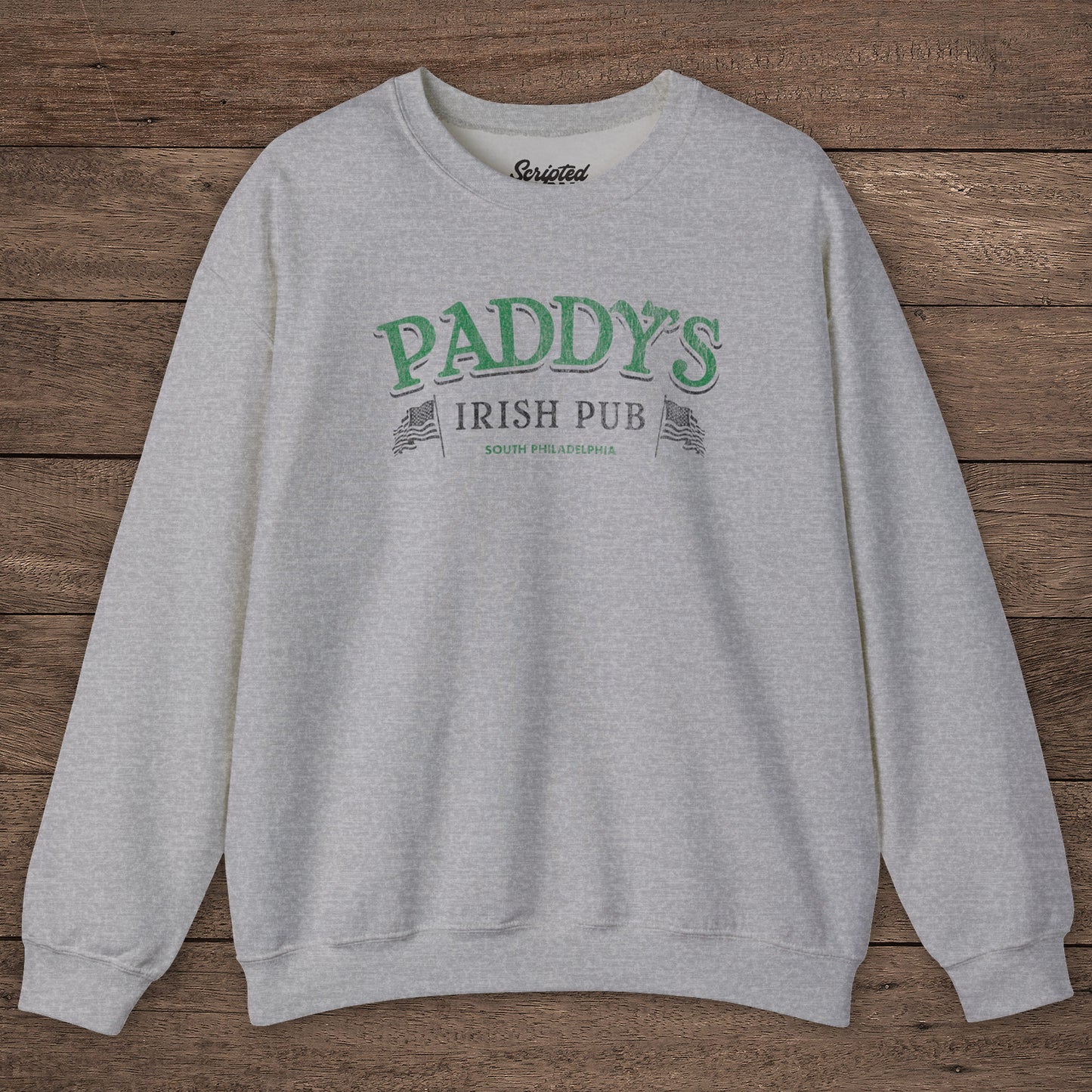Heather Gray Crewneck Sweatshirt with the Paddy's Pub logo graphic from the TV Show Its Always Sunny in Philadelphia in a vintage style.