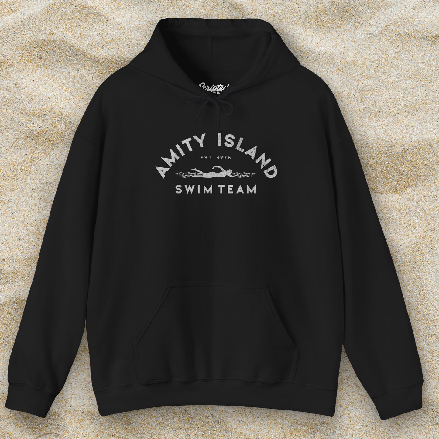 Front view of a black colored Soft Unisex Hoodie Heavy Blend Hooded Sweatshirt featuring an Amity Island Swim Team logo graphic, designed by ScriptedBrand, and  inspired by the movie Jaws in a vintage distressed style.