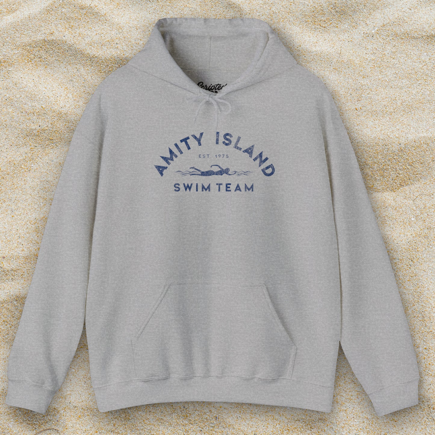 Front view of a sport heather grey colored Soft Unisex Hoodie Heavy Blend Hooded Sweatshirt featuring an Amity Island Swim Team logo graphic, designed by ScriptedBrand, and  inspired by the movie Jaws in a vintage distressed style.