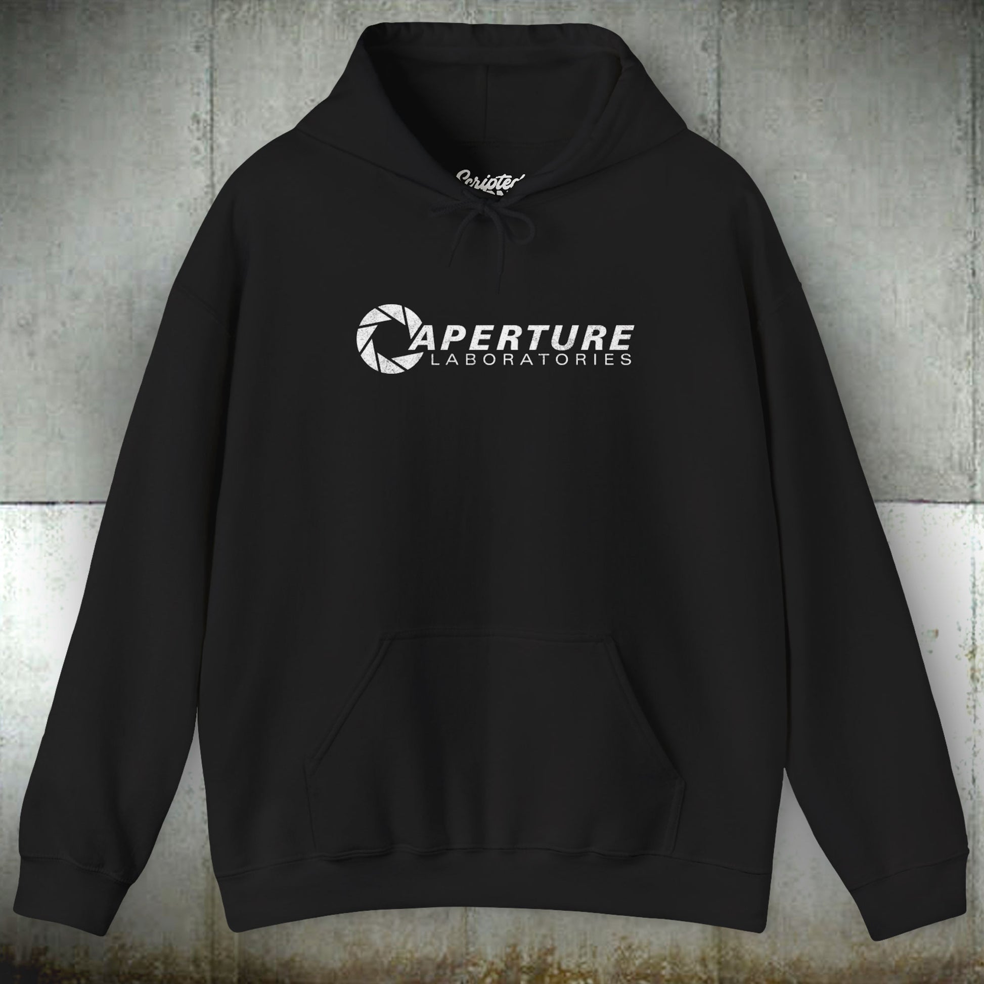Front view of a black colored Unisex Hoodie Heavy Blend Hooded Sweatshirt featuring the Aperture Laboratories logo from the video game Portal and Portal 2 in a vintage distressed style, sold by ScriptedBrand.
