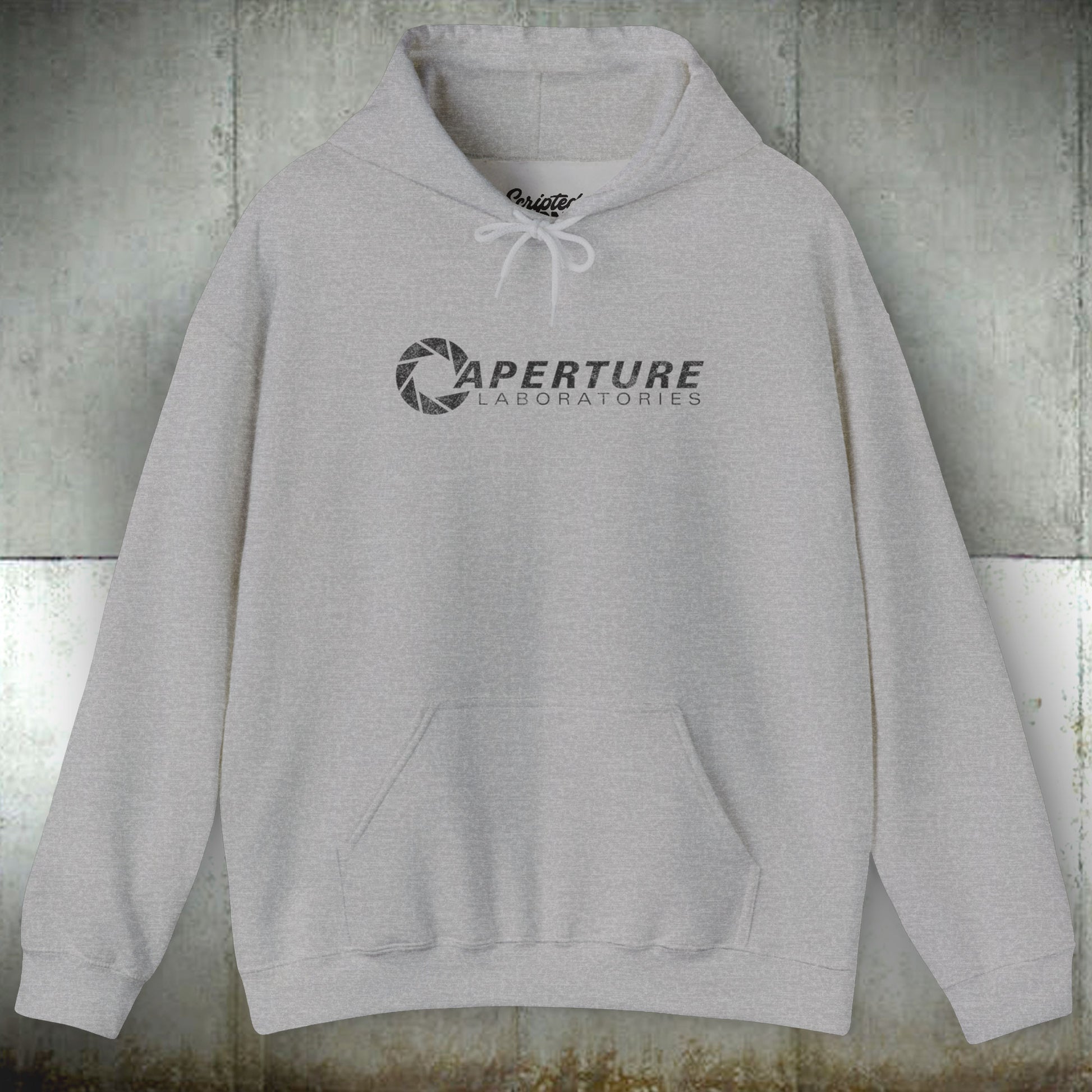 Front view of a sport gray heather colored Unisex Hoodie Heavy Blend Hooded Sweatshirt featuring the Aperture Laboratories logo from the video game Portal and Portal 2 in a vintage distressed style, sold by ScriptedBrand.