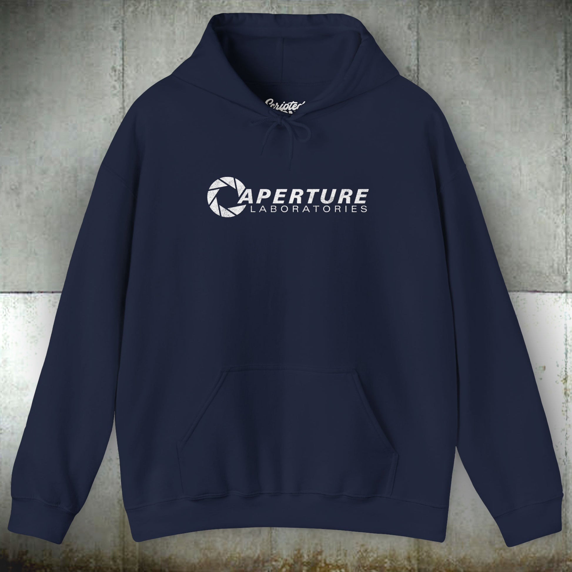 Front view of a navy blue colored Unisex Hoodie Heavy Blend Hooded Sweatshirt featuring the Aperture Laboratories logo from the video game Portal and Portal 2 in a vintage distressed style, sold by ScriptedBrand.