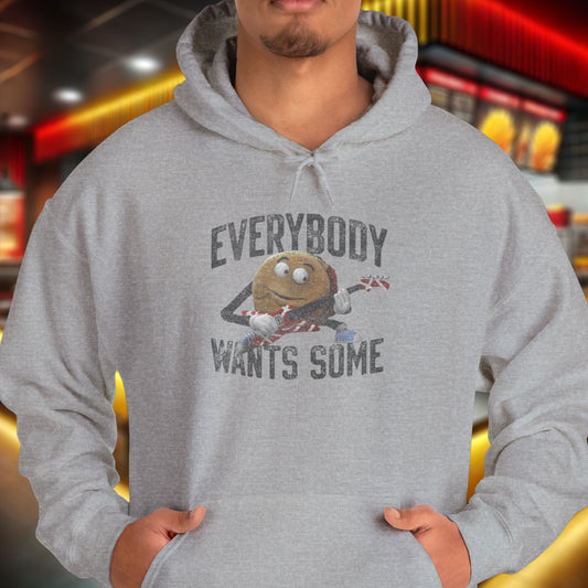 Male model wearing a sport athletic grey colored soft Unisex Hoodie Heavy Blend Hooded Sweatshirt featuring the phrase EVERYBODY WANTS SOME with a graphic of the Van Halen singing hamburger playing guitar from the movie Better Off Dead, designed by ScriptedBrand in a vintage distressed style.