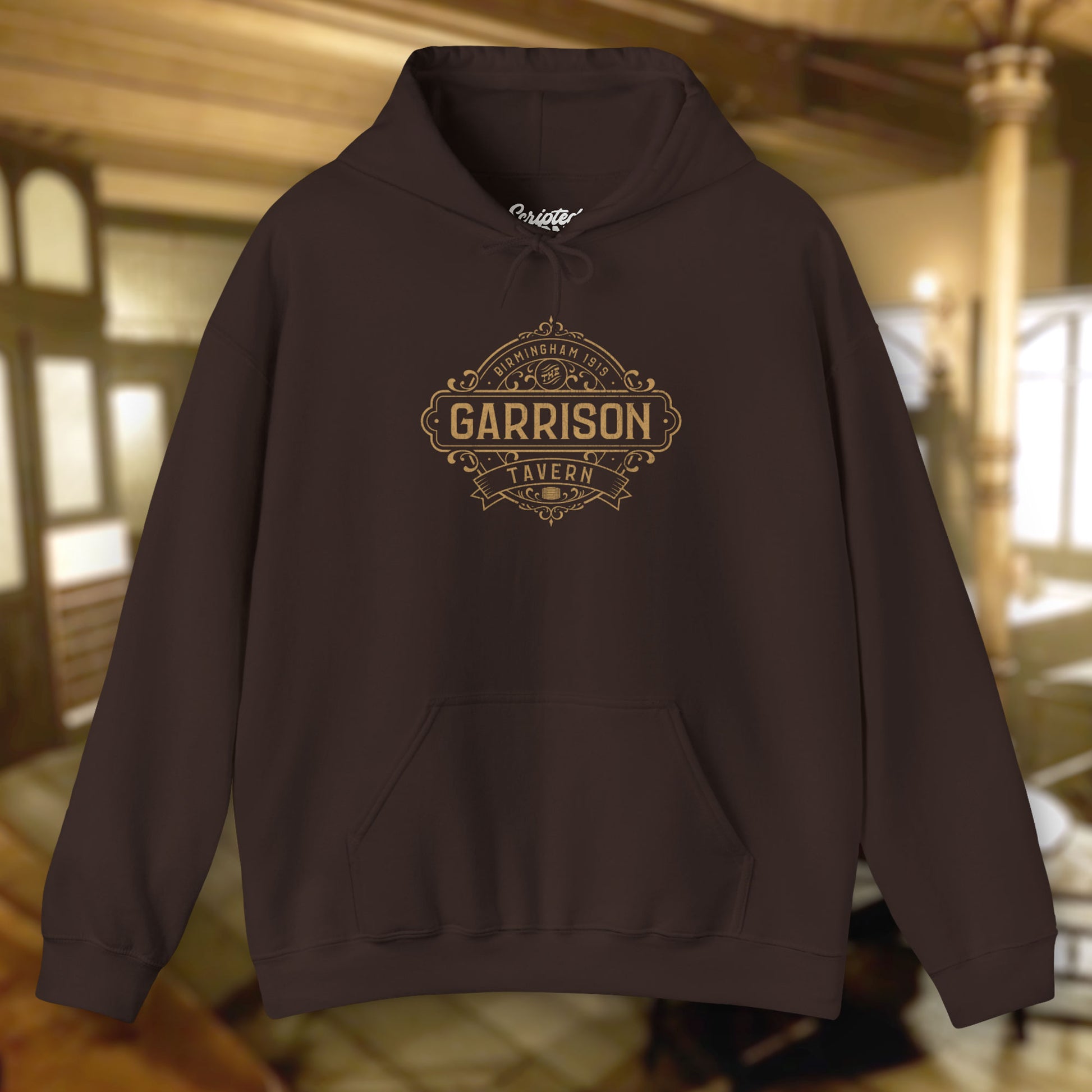 Front view of a dark chocolate Soft Unisex Hoodie Heavy Blend Hooded Sweatshirts featuring the Garrison Tavern Bar Logo Graphic inspired by the TV show and movie Peaky Blinders in a vintage distressed style sold by ScriptedBrand.