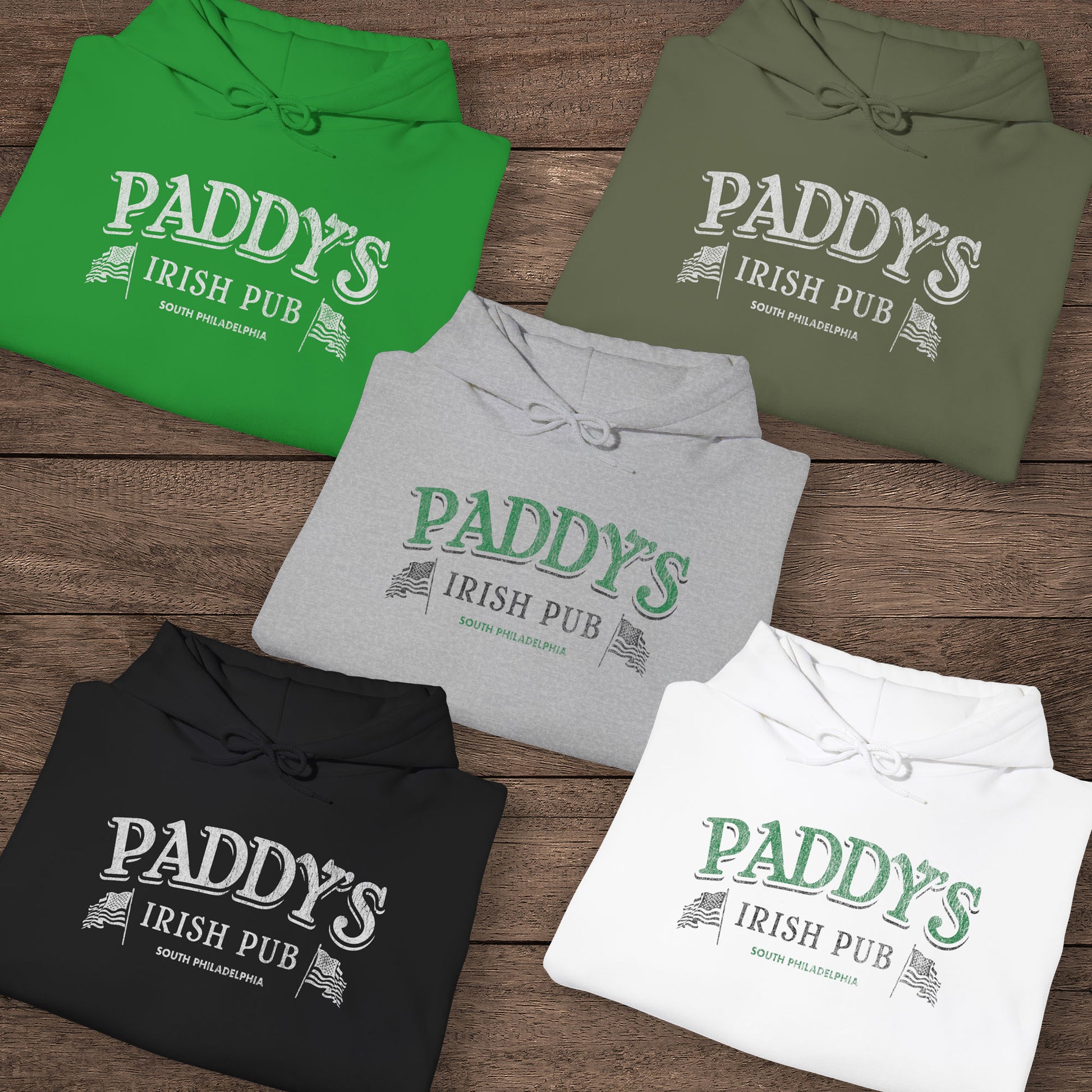 Five folded Hoodie Sweatshirts with the Paddy's Pub logo graphic from the TV Show Its Always Sunny in Philadelphia in a vintage style.