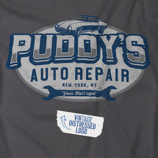Closeup view of a charcoal gray soft Unisex Hoodie Heavy Blend Hooded Sweatshirt featuring a Puddy's Auto Repair graphic designed by ScriptedBrand inspired by the TV show Seinfeld in a vintage distressed style.