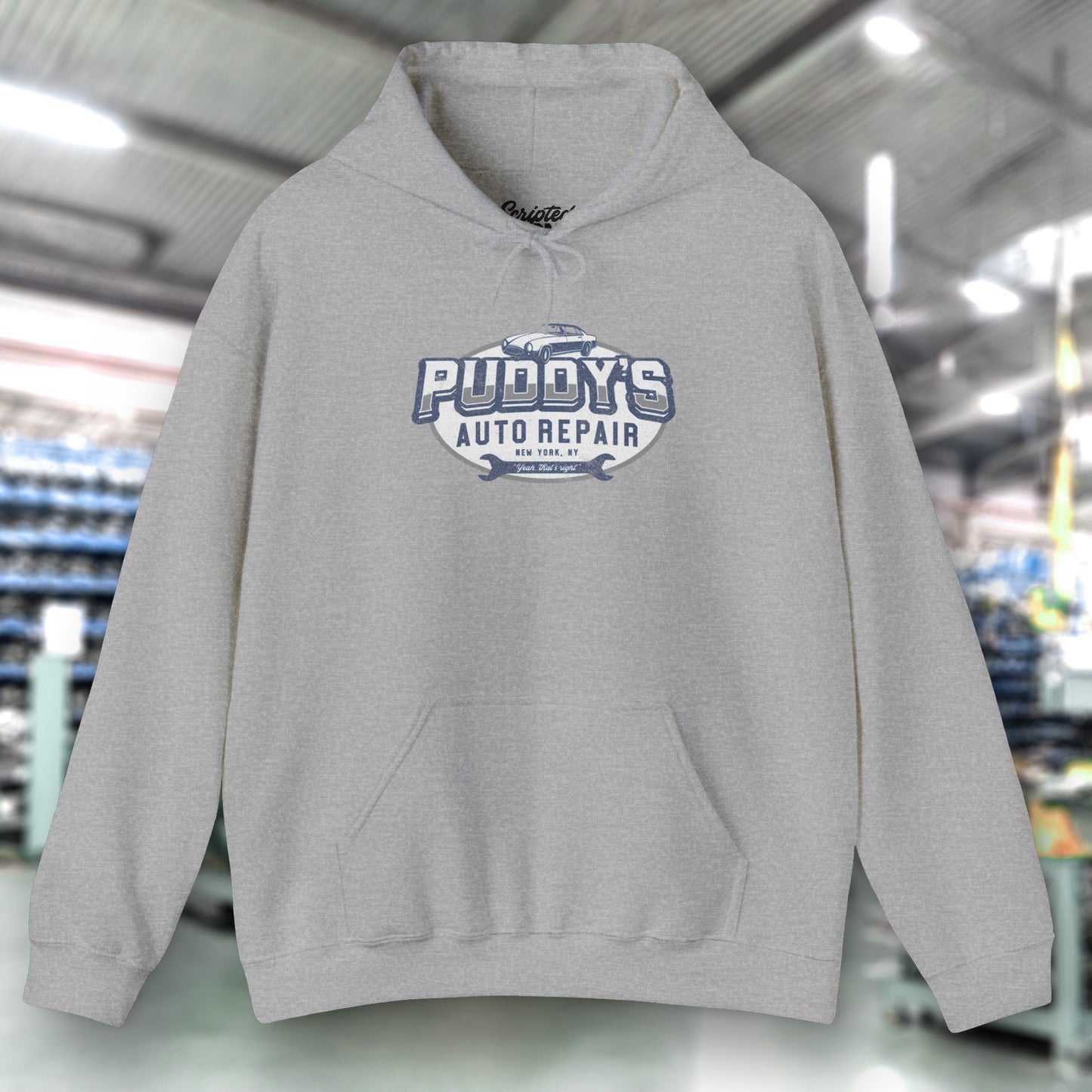 Front view of a sport heather gray soft Unisex Hoodie Heavy Blend Hooded Sweatshirt featuring a Puddy's Auto Repair graphic designed by ScriptedBrand inspired by the TV show Seinfeld in a vintage distressed style.