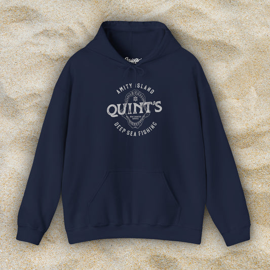 Front view of a navy blue Soft Unisex Hoodie Heavy Blend Hooded Sweatshirt featuring a Quint's Deep Sea Fishing Boat Charters logo graphic, designed by ScriptedBrand, and inspired by the movie Jaws in a vintage distressed style.