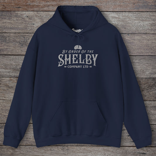 Front view of a Navy Shelby Company Ltd hoodie with vintage logo from Peaky Blinders, featuring flat cap and razor blades.
