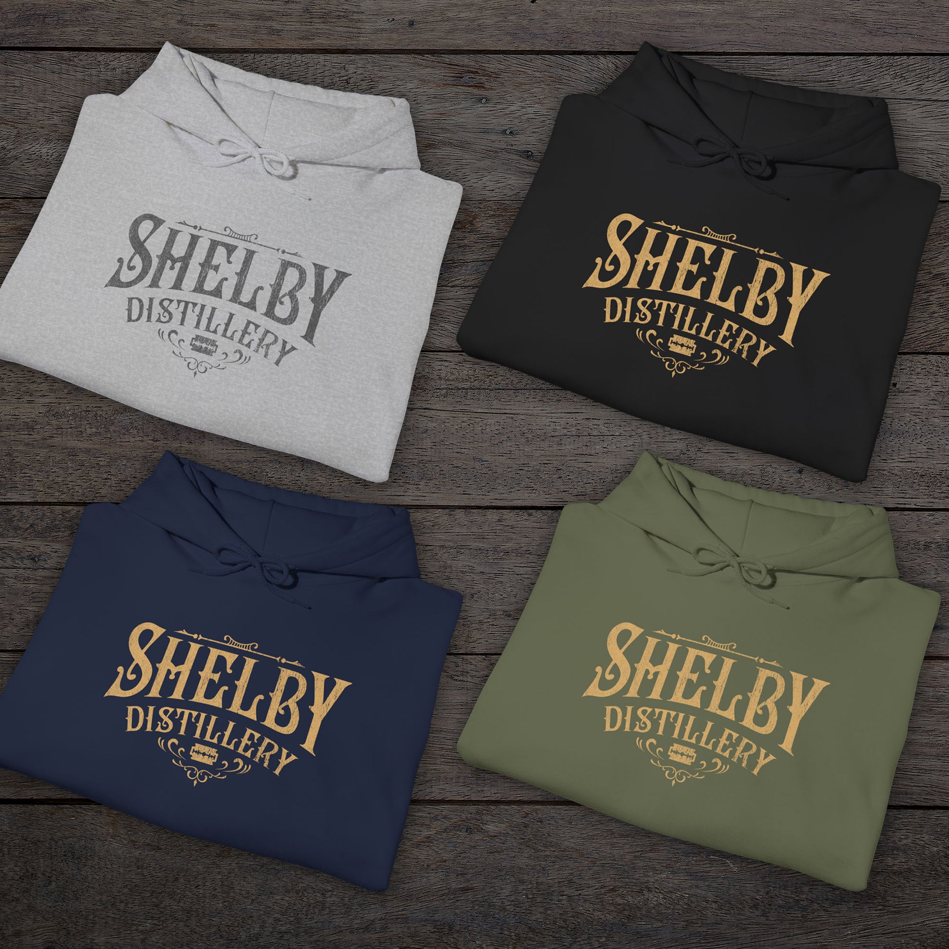 Group of 4 folded Unisex Hoodie Heavy Blend Hooded Sweatshirts featuring the Shelby Company Limited Distillery Logo Graphic inspired by the TV show and movie Peaky Blinders in a vintage distressed ink-stamped worn-in style.