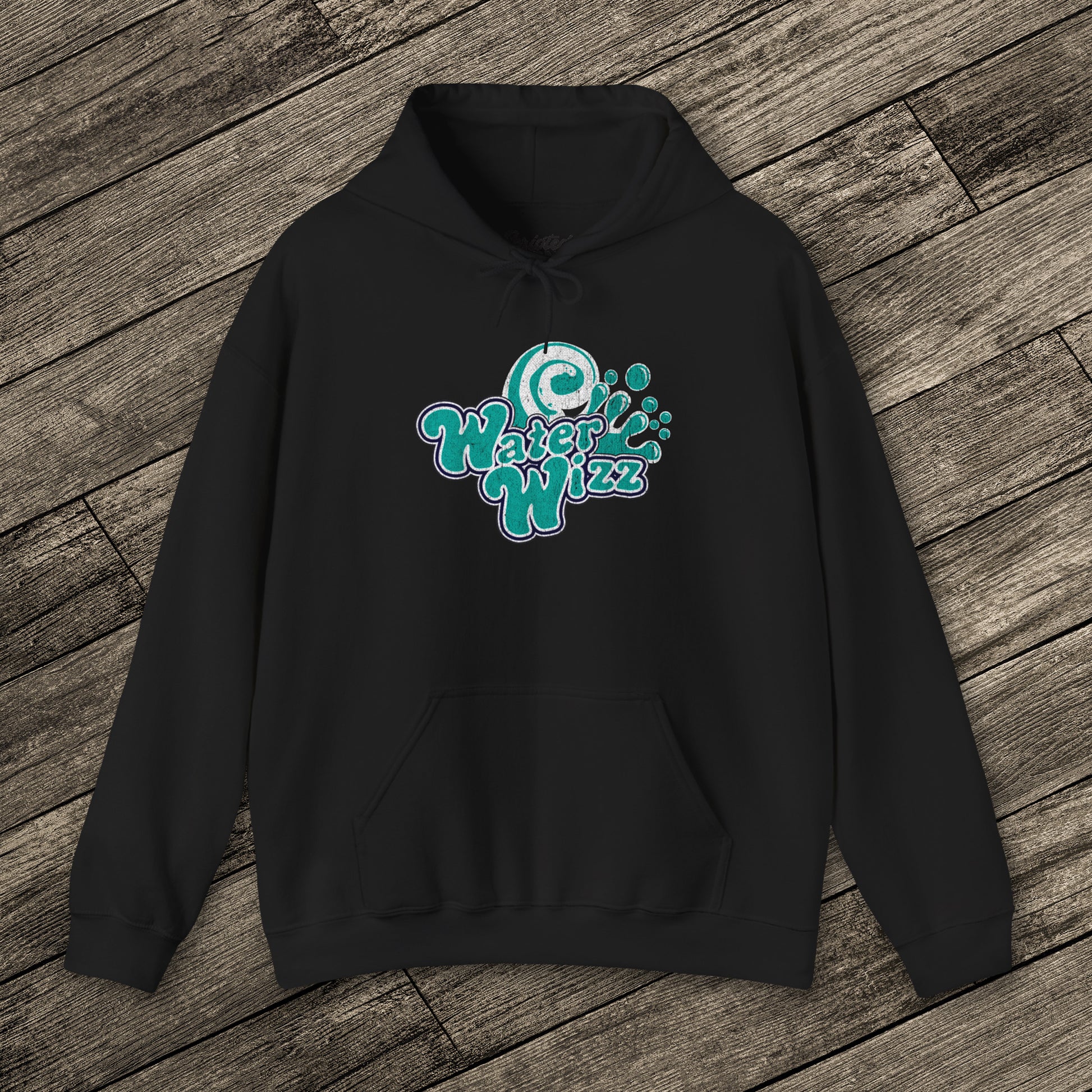 Black Gildan 18500 pullover hoodie with vintage distressed Water Wizz logo from Grown Ups on the chest, shown on wood floor.