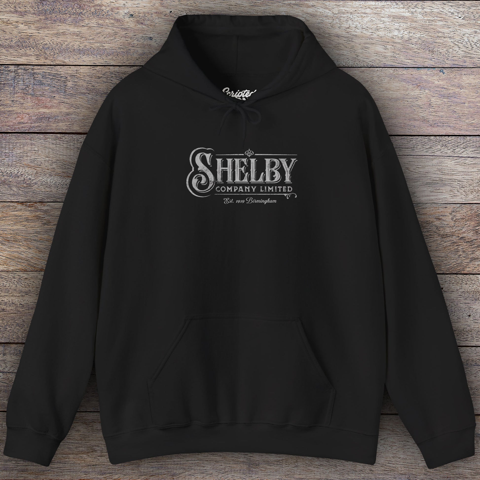 Black colored Soft Unisex Hoodie Heavy Blend Hooded Sweatshirt featuring the fictional logo Shelby Company Limited from the TV series Peaky Blinders in a vintage distressed style.