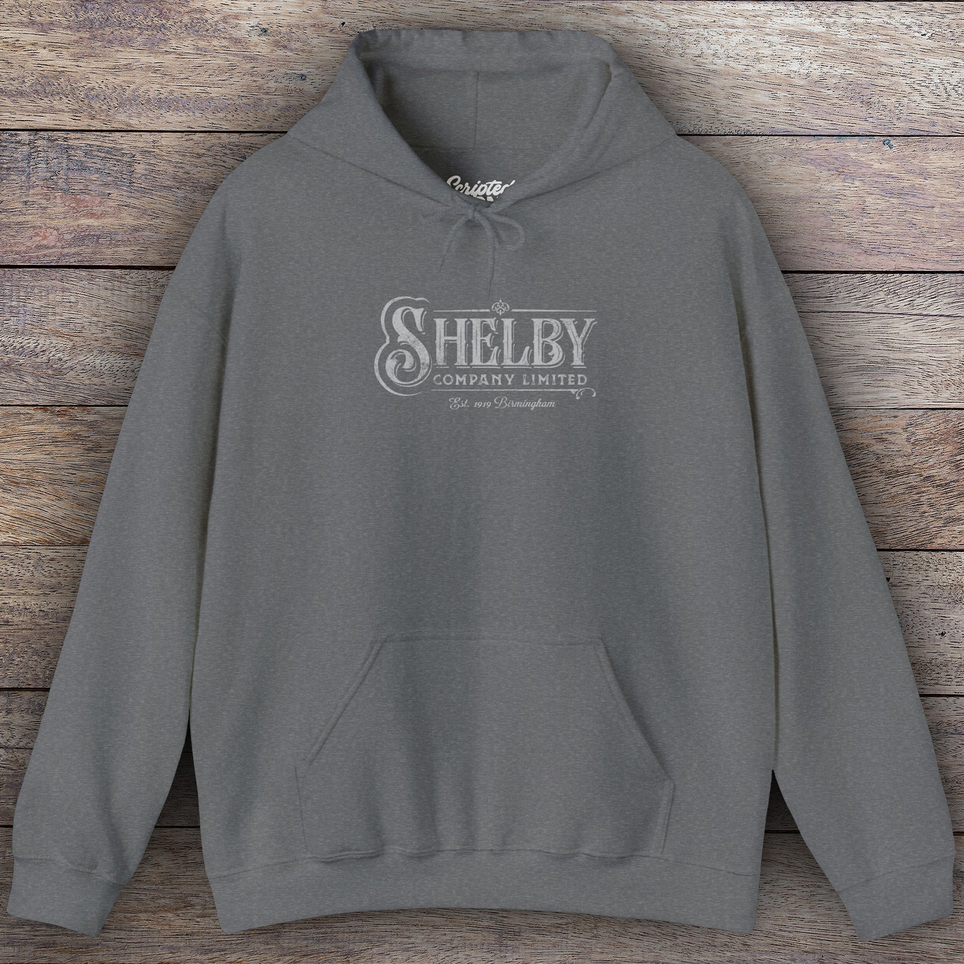 Dark heather gray colored Soft Unisex Hoodie Heavy Blend Hooded Sweatshirt featuring the fictional logo Shelby Company Limited from the TV series Peaky Blinders in a vintage distressed style.