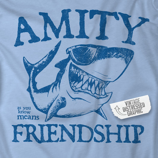 Closeup of blue Bella+Canvas t-shirt with a vintage-style Amity Island “Friendship” shark graphic inspired by the movie Jaws