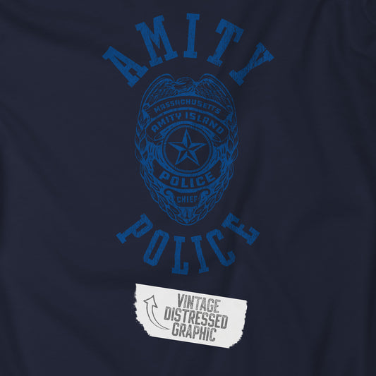 Closeup view of a navy blue colored Soft unisex Bella+Canvas 3001 short-sleeve t-shirt featuring an Amity Island Police logo graphic, designed by ScriptedBrand, and  inspired by the movie Jaws in a vintage distressed style.