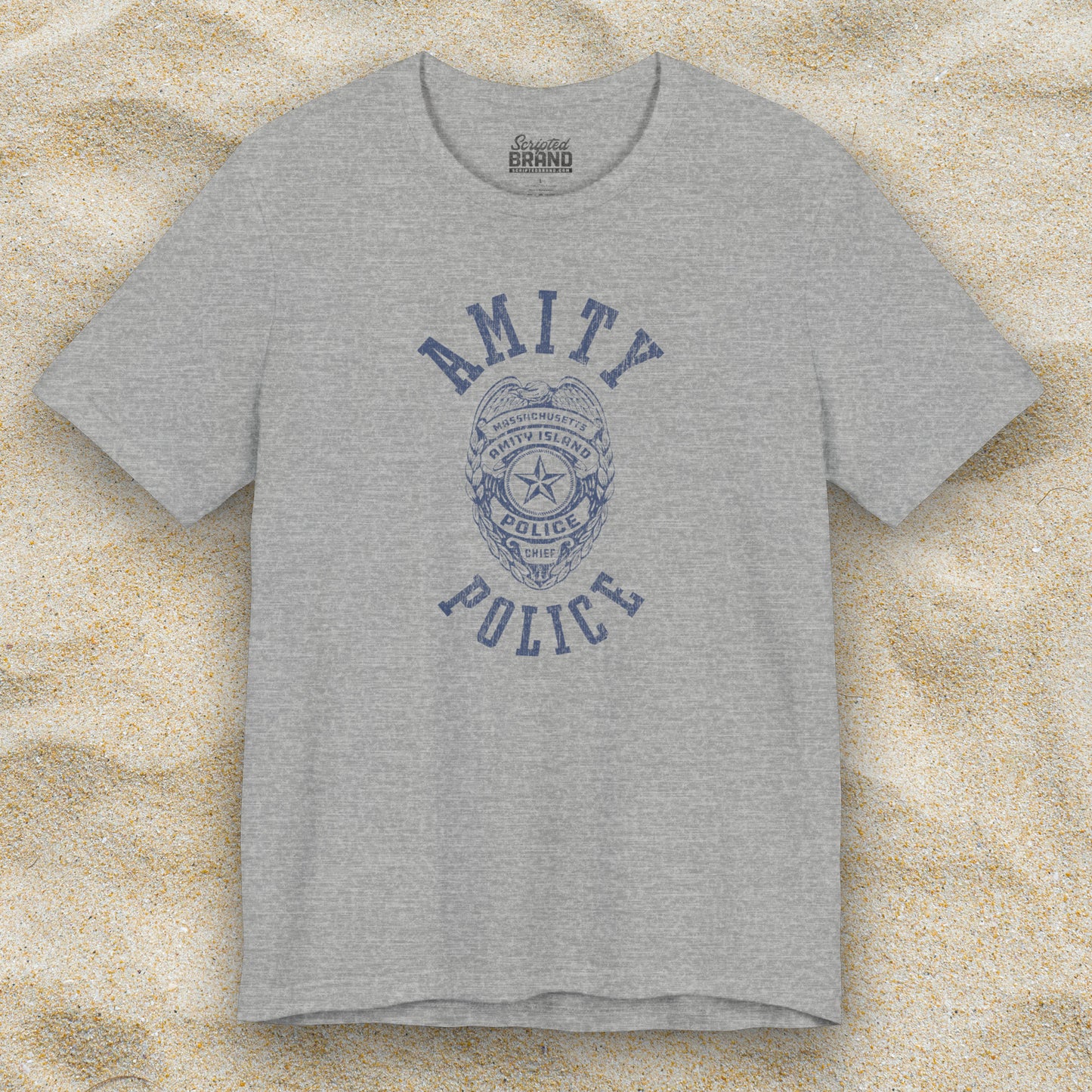 Front view of an athletic heather grey colored Soft unisex Bella+Canvas 3001 short-sleeve t-shirt featuring an Amity Island Police logo graphic, designed by ScriptedBrand, and  inspired by the movie Jaws in a vintage distressed style.