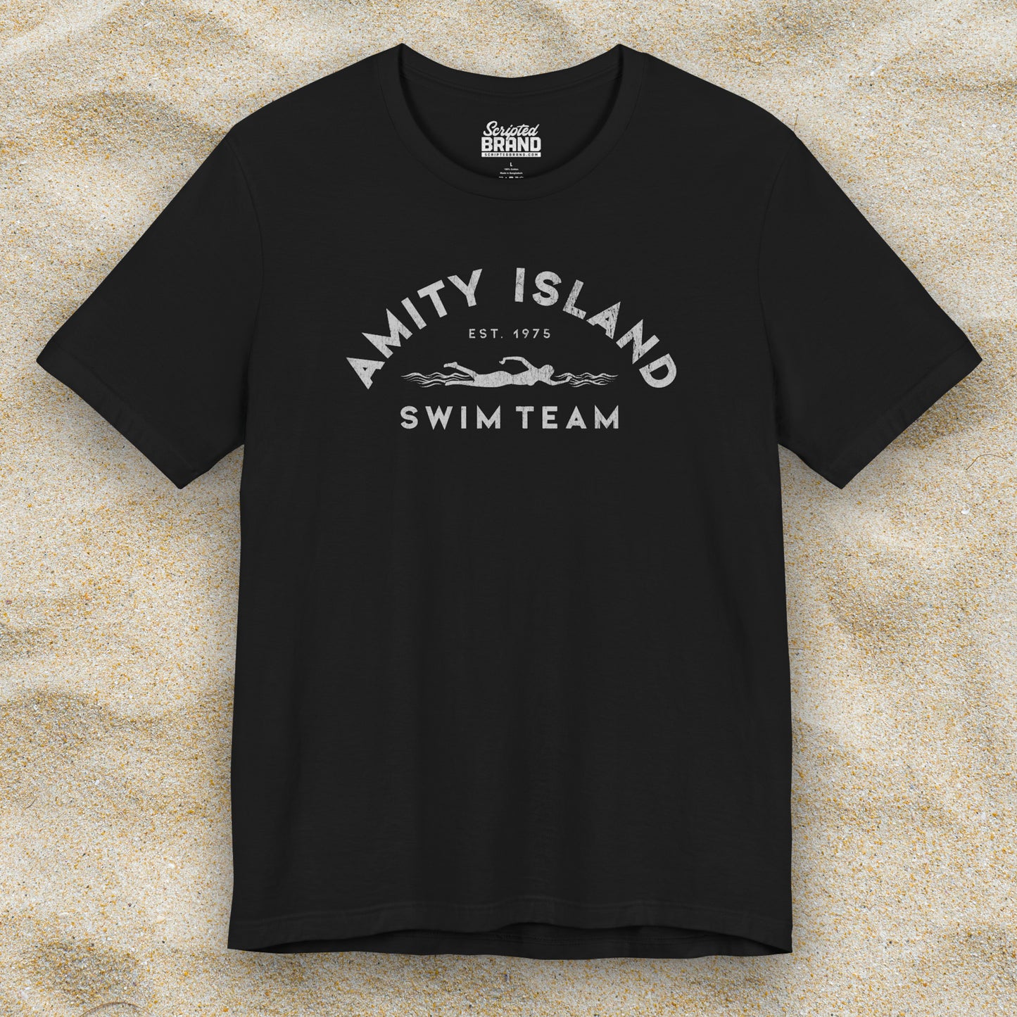 Front view of a black colored Soft unisex Bella+Canvas 3001 short-sleeve t-shirt featuring an Amity Island Swim Team logo graphic, designed by ScriptedBrand, and  inspired by the movie Jaws in a vintage distressed style.