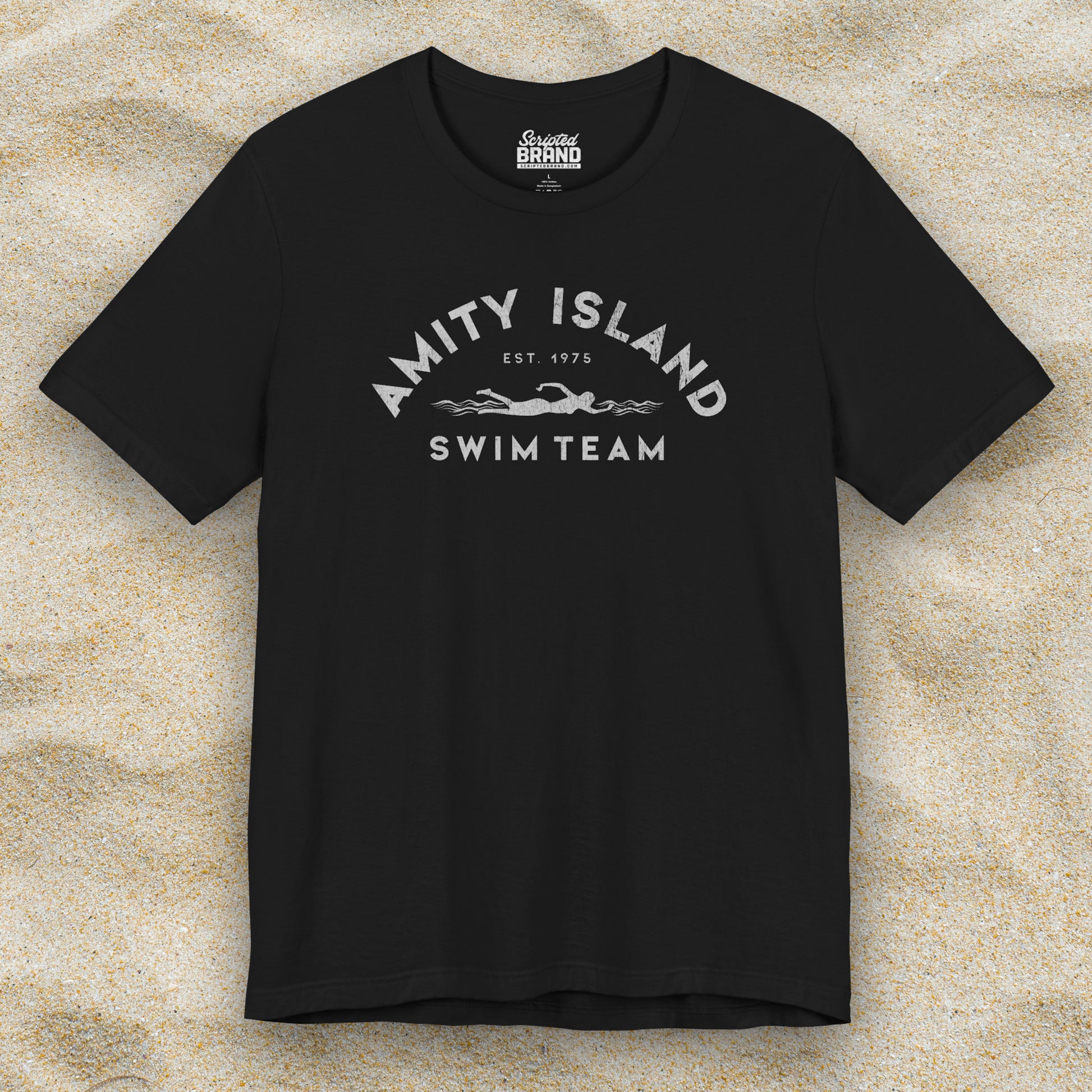 Front view of a black colored Soft unisex Bella+Canvas 3001 short-sleeve t-shirt featuring an Amity Island Swim Team logo graphic, designed by ScriptedBrand, and  inspired by the movie Jaws in a vintage distressed style.