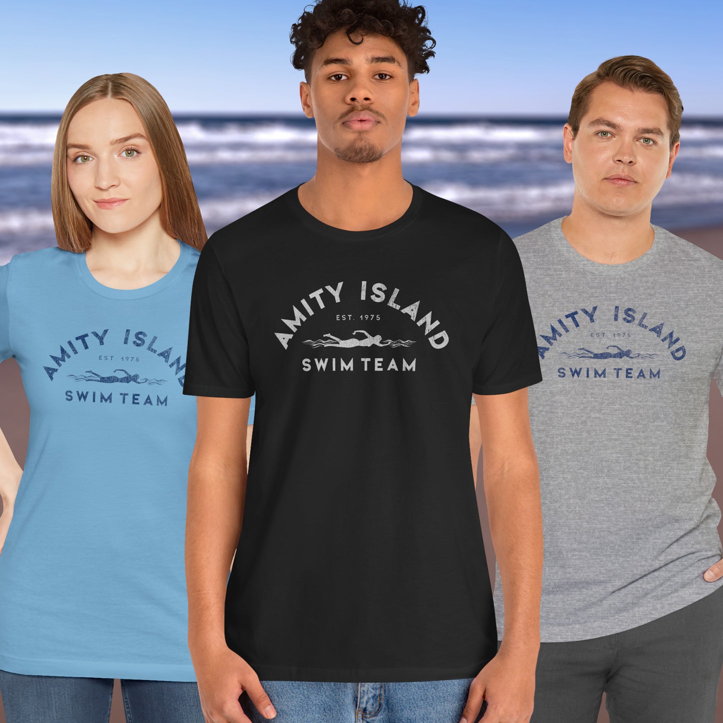 3 models wearing Soft unisex Bella+Canvas 3001 short-sleeve t-shirts featuring an Amity Island Swim Team logo graphic, designed by ScriptedBrand, and  inspired by the movie Jaws in a vintage distressed style.
